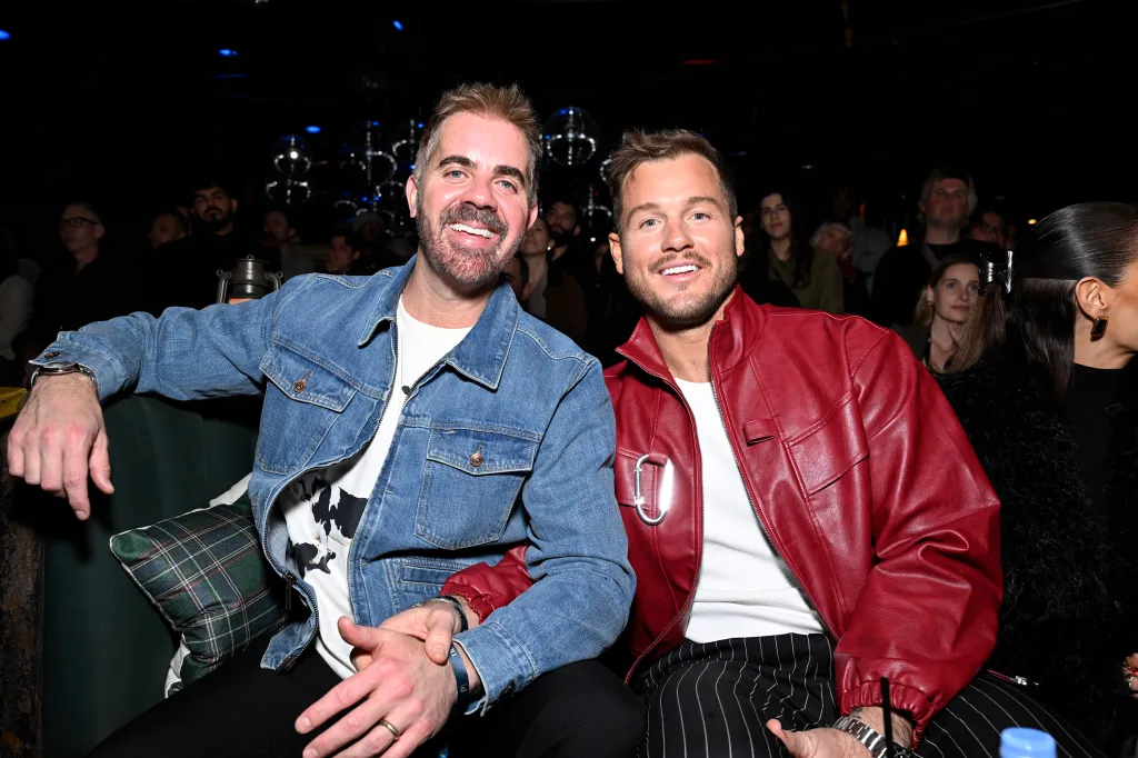 Jordan C. Brown and Colton Underwood smiling at "The Traitors Season 4 Premiere Watch Party".