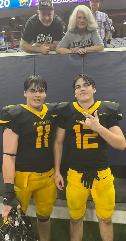 Austin and Hunter Metcalf in football uniforms.
