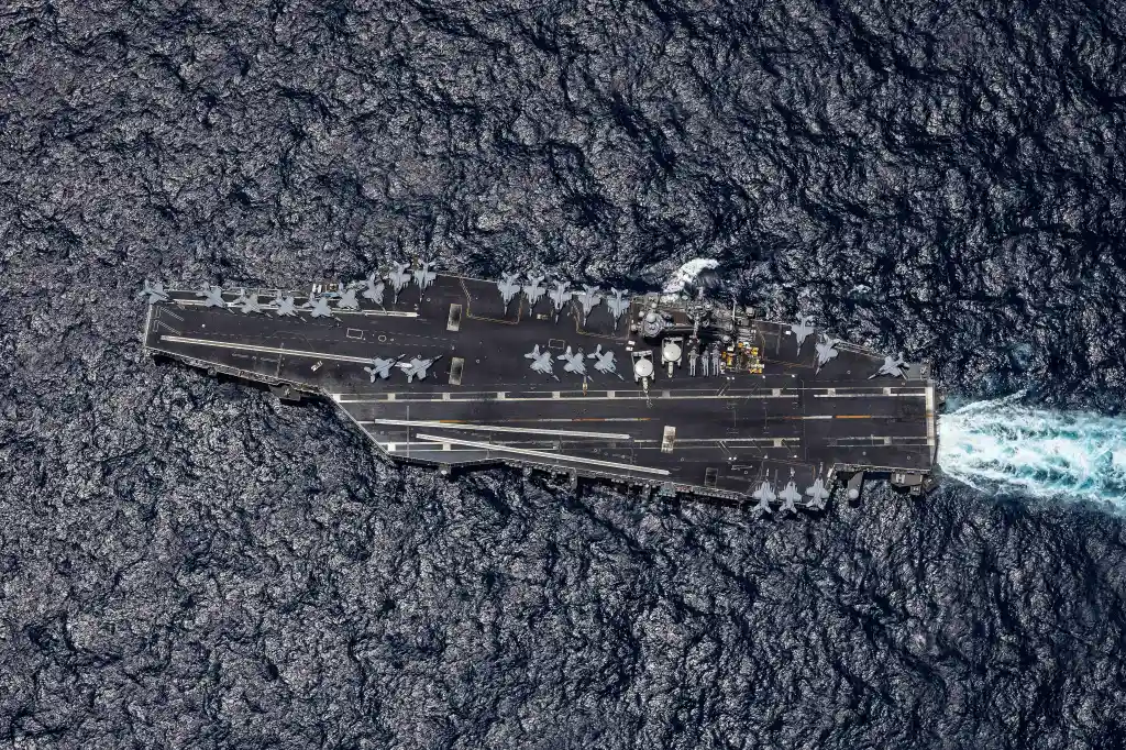 Overhead view of the USS George H.W. Bush aircraft carrier on the Arabian Sea during Operation Epic Fury.