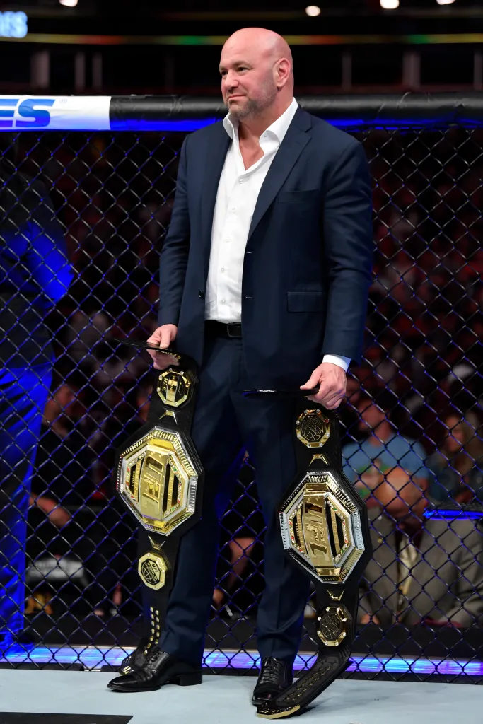 UFC President Dana White holds two Legacy Championship belts.