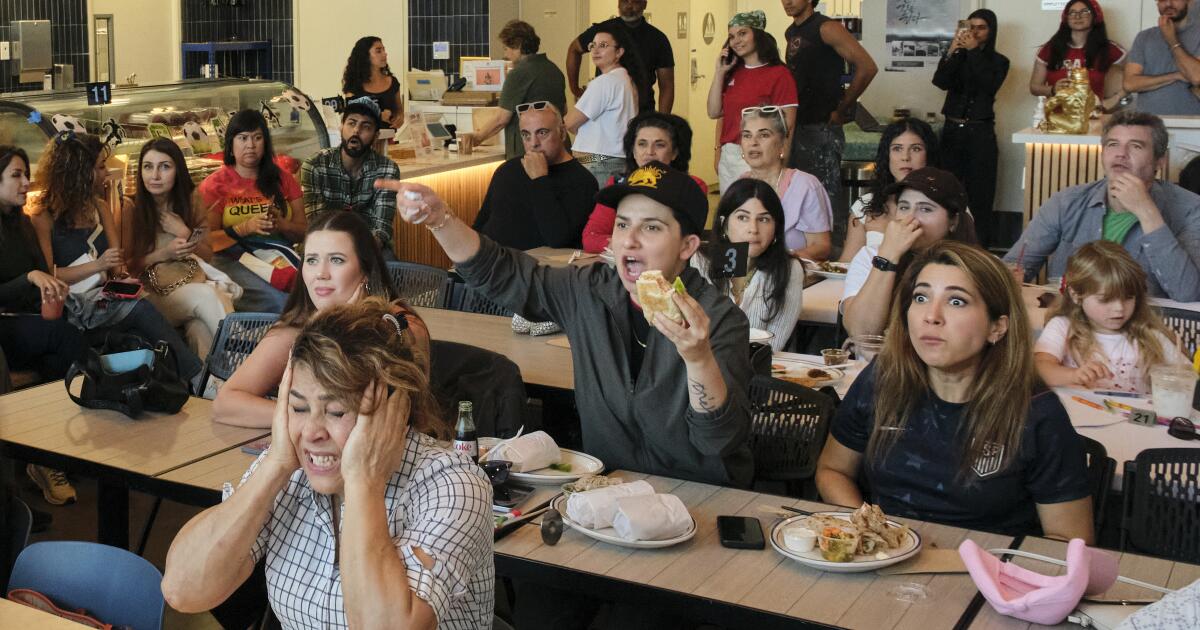 Iranians divided on war unite to watch the World Cup