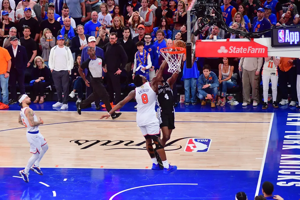 OG Anunoby #8 of the New York Knicks blocks De'Aaron Fox #4 of the San Antonio Spurs during Game Four of the 2026 NBA Finals.