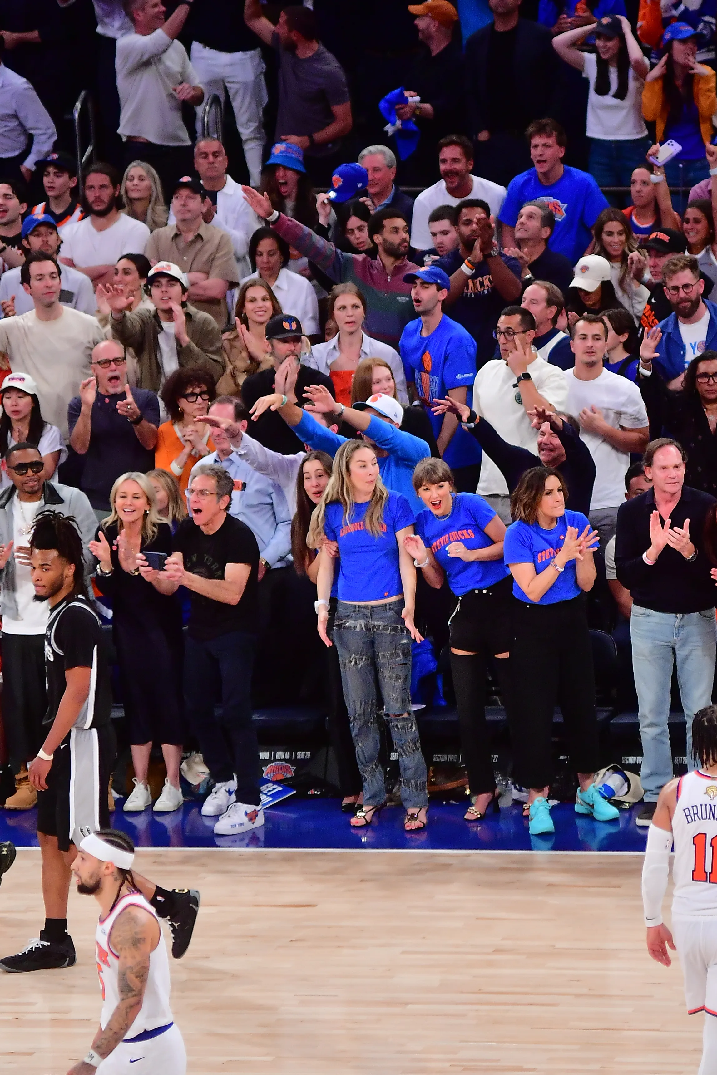 Celebrities including Nas, Christine Taylor, Ben Stiller, Alana Haim, Taylor Swift, Este Haim, and Mariska Hargitay at an NBA Finals game.