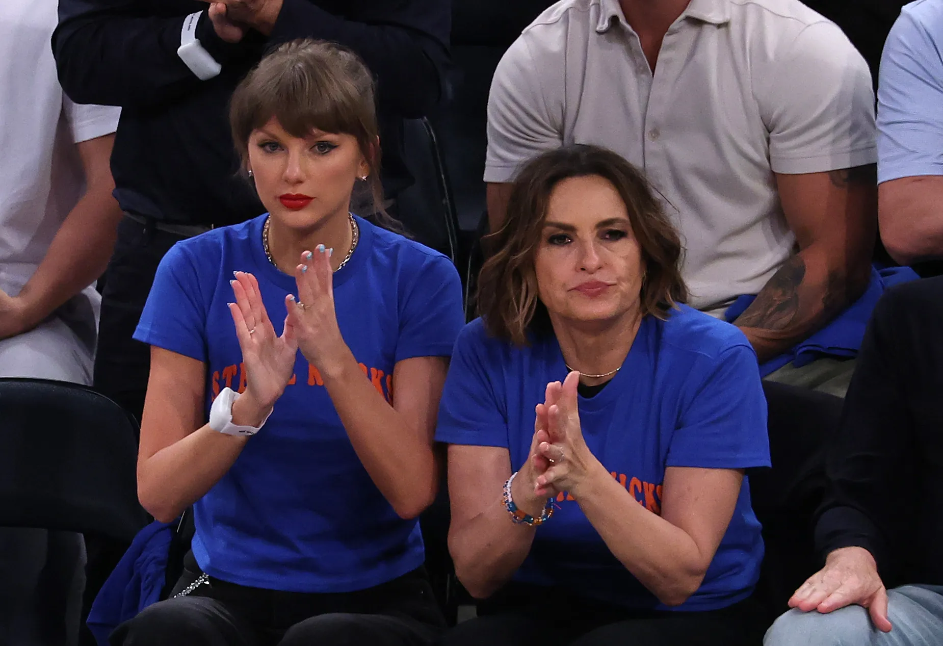 Taylor Swift and Mariska Hargitay clap during Game Four of the 2026 NBA Finals.
