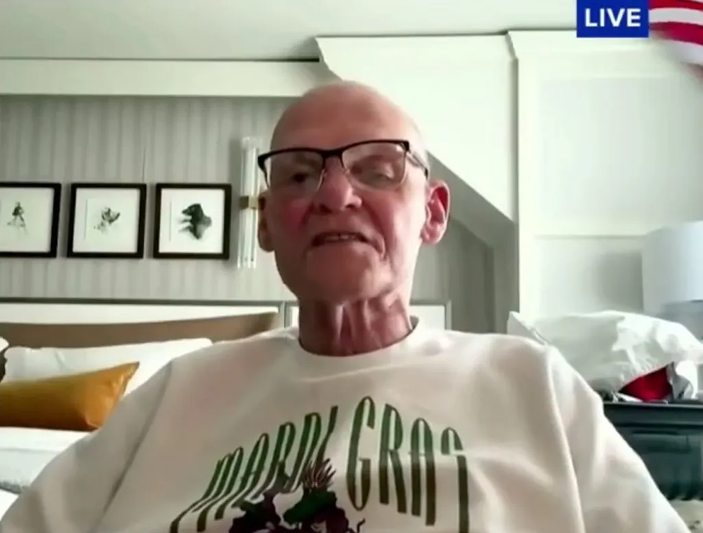 Veteran Democratic strategist James Carville in a white "Mardi Gras" T-shirt.