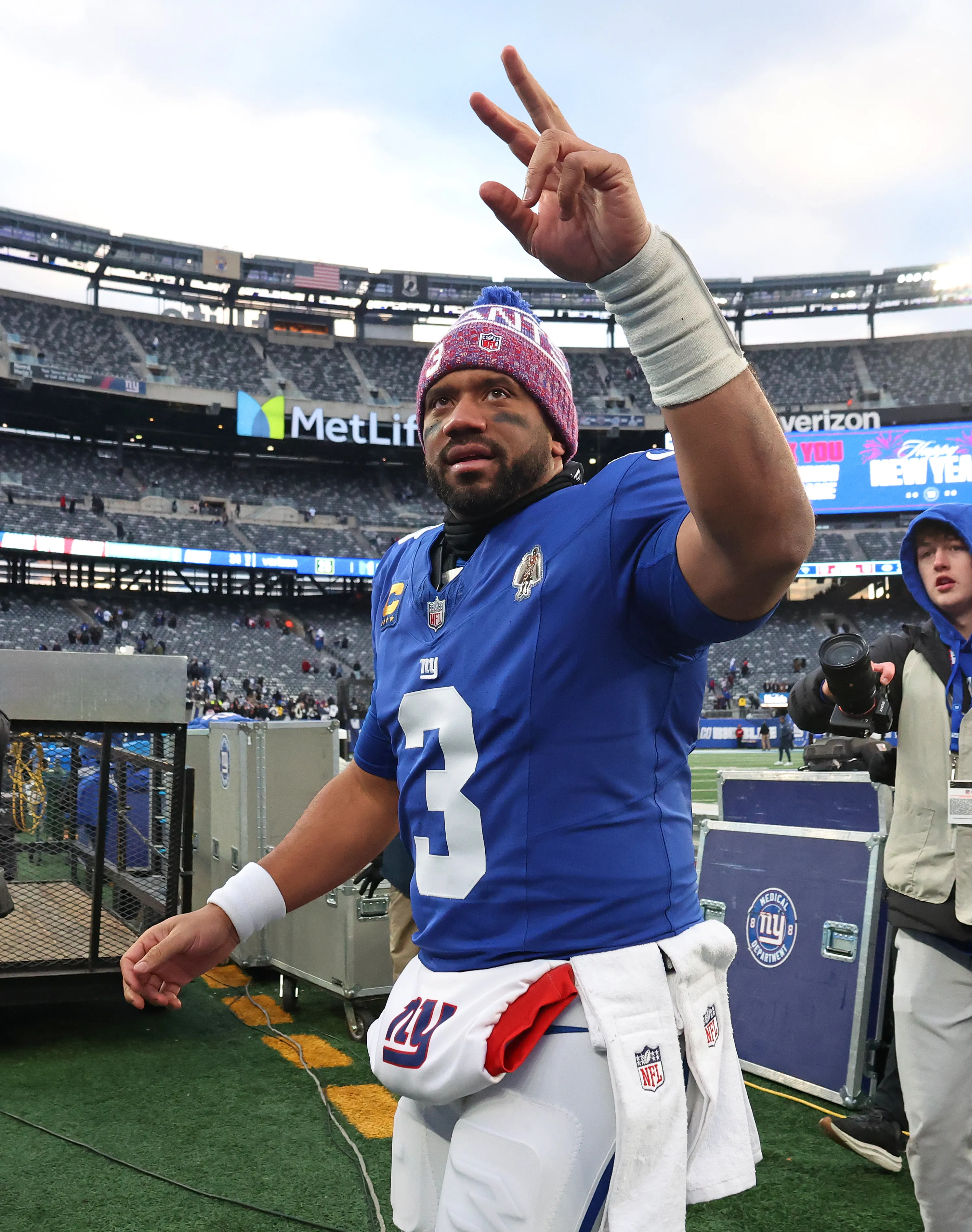 New York Giants quarterback Russell Wilson waves to fans after defeating the Dallas Cowboys.