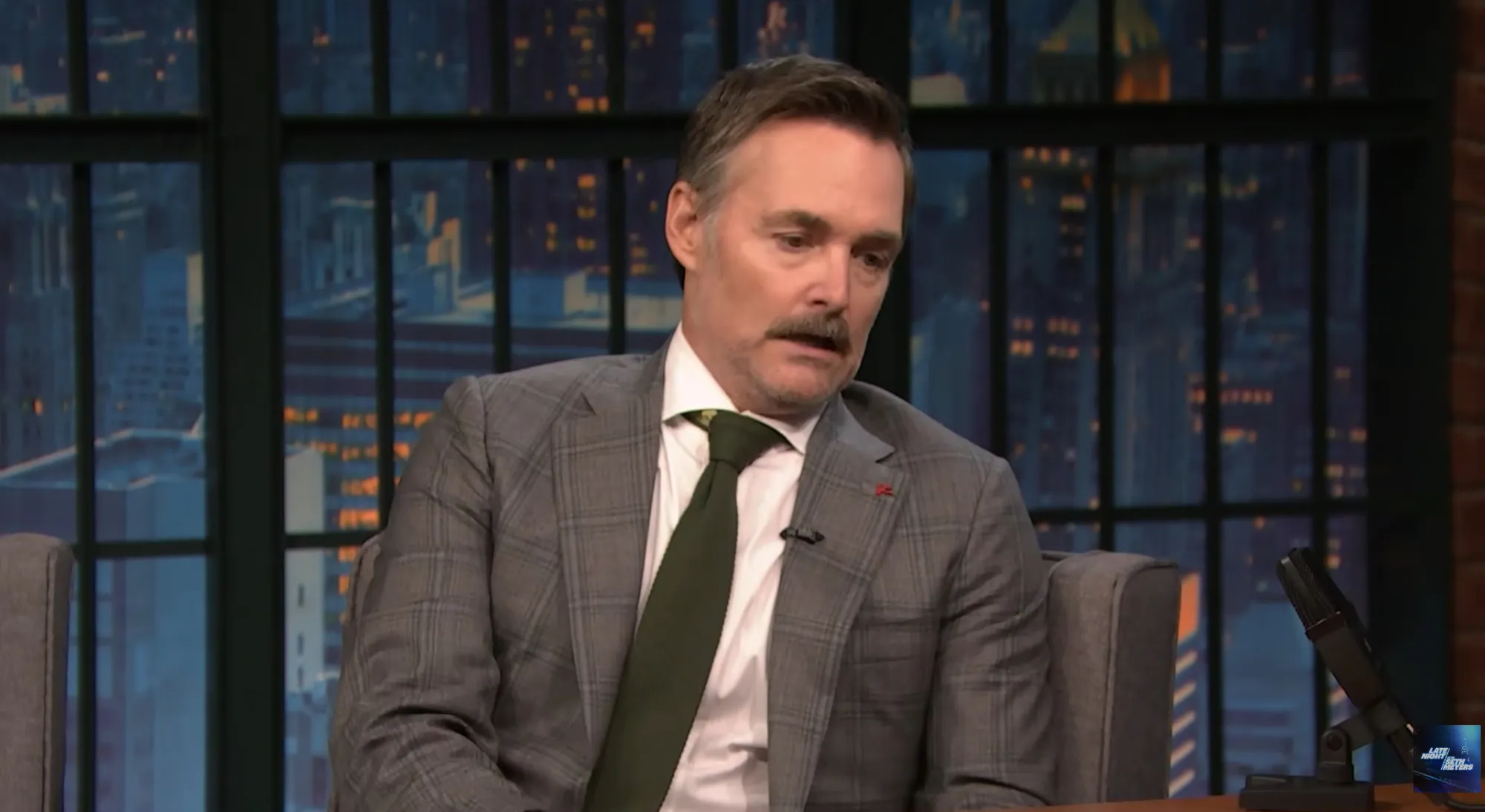Will Forte speaking on Late Night with Seth Meyers.