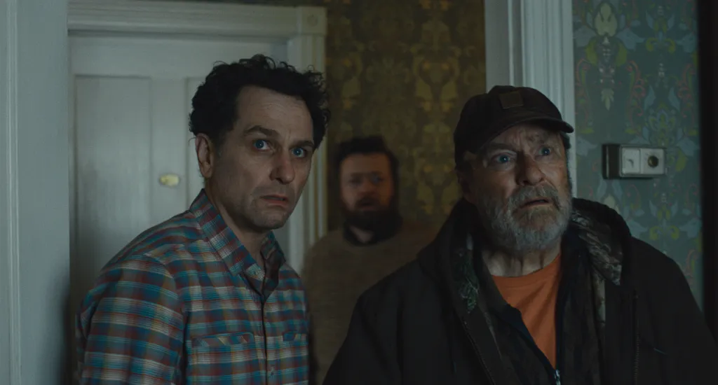 Matthew Rhys, Kate O'Flynn, and Stephen Root looking surprised.