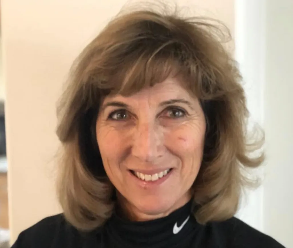 Headshot of Rosanne Masi Marquis smiling.