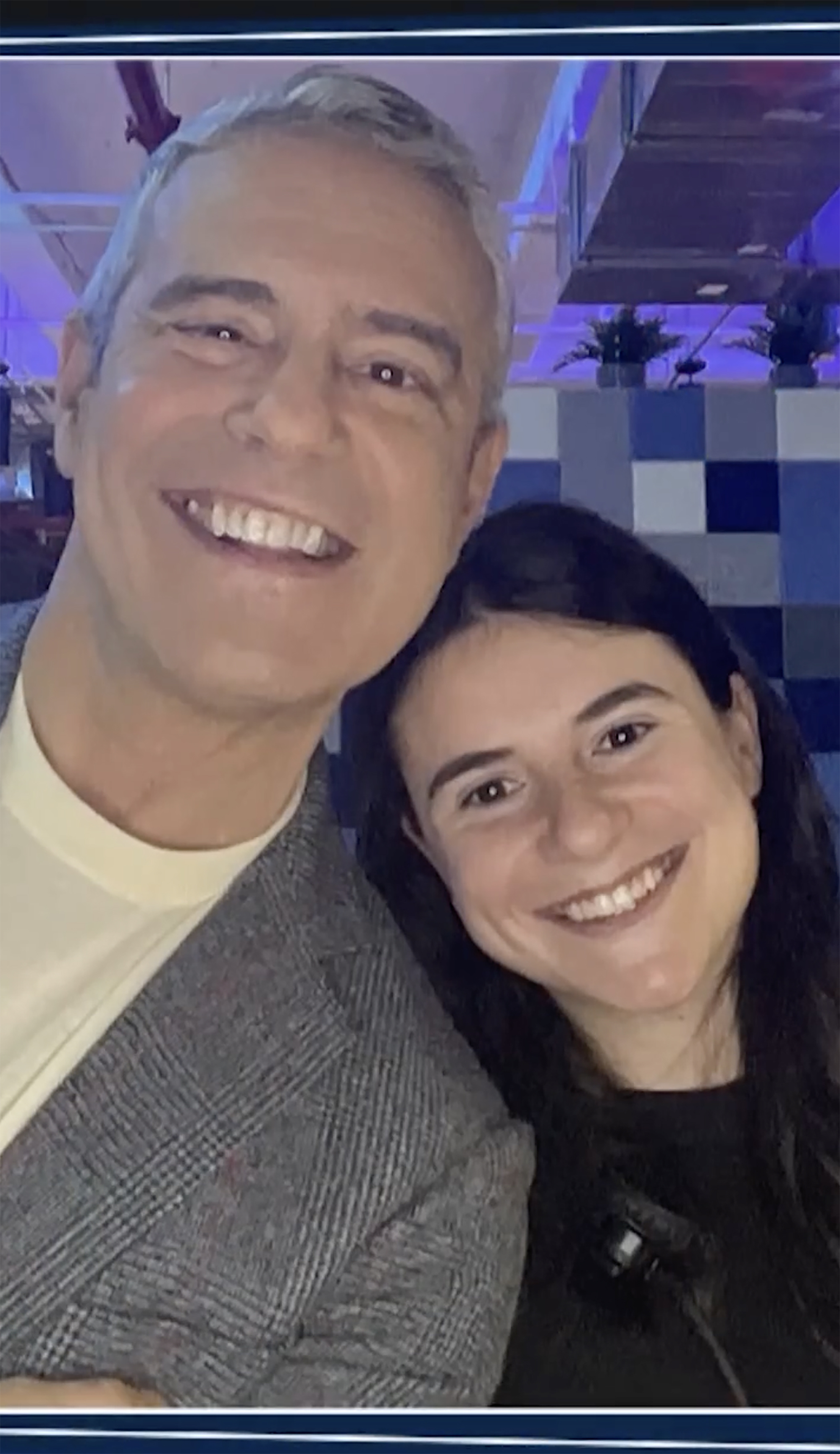 Andy Cohen and Kyra smiling in a selfie.