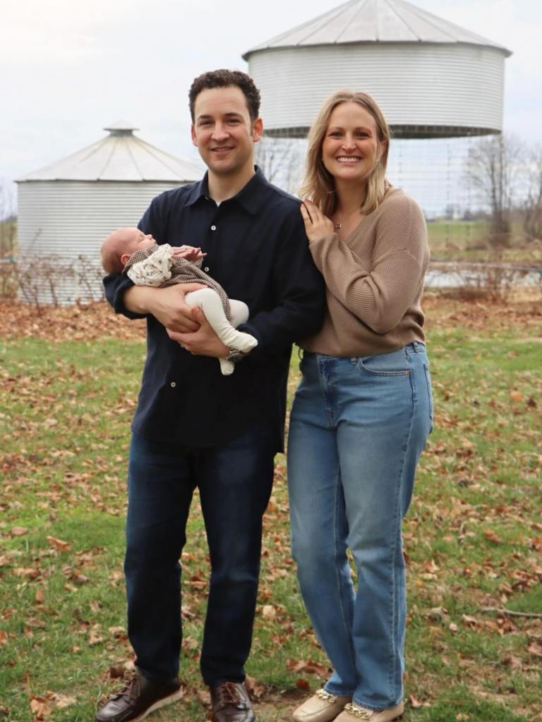 Ben Savage and his wife holding their baby.