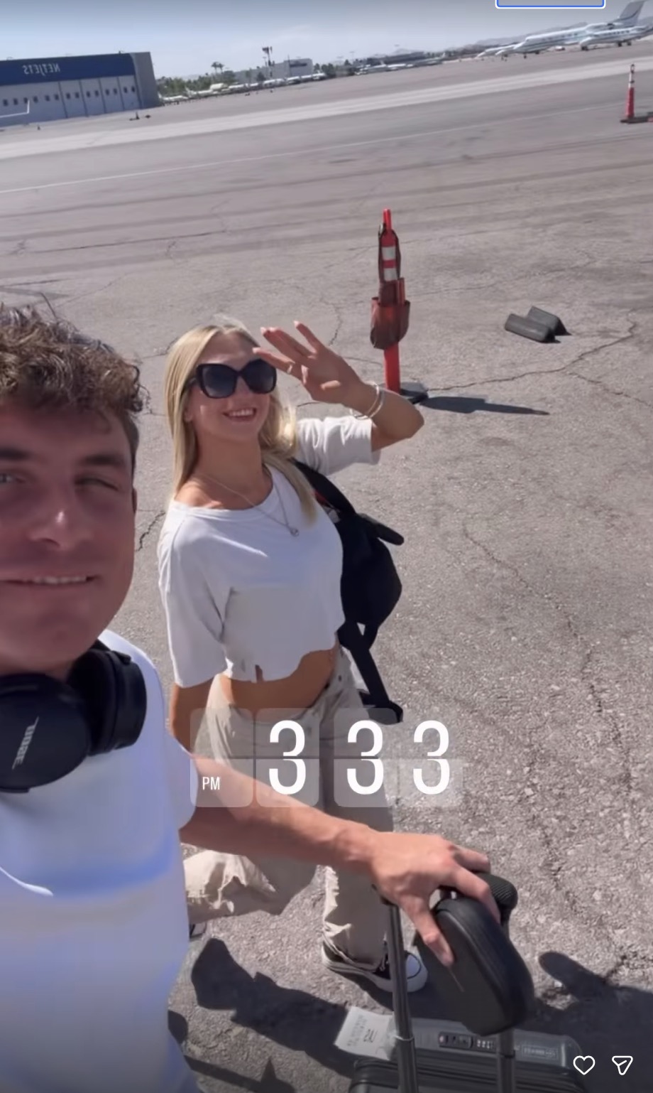 James Kennedy and Jordan Meyers on an airport tarmac.