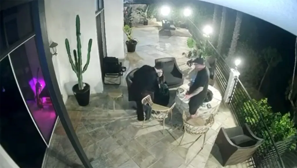 Tom Sandoval appears to shove Victoria Robinson's dad toward a lit firepit.