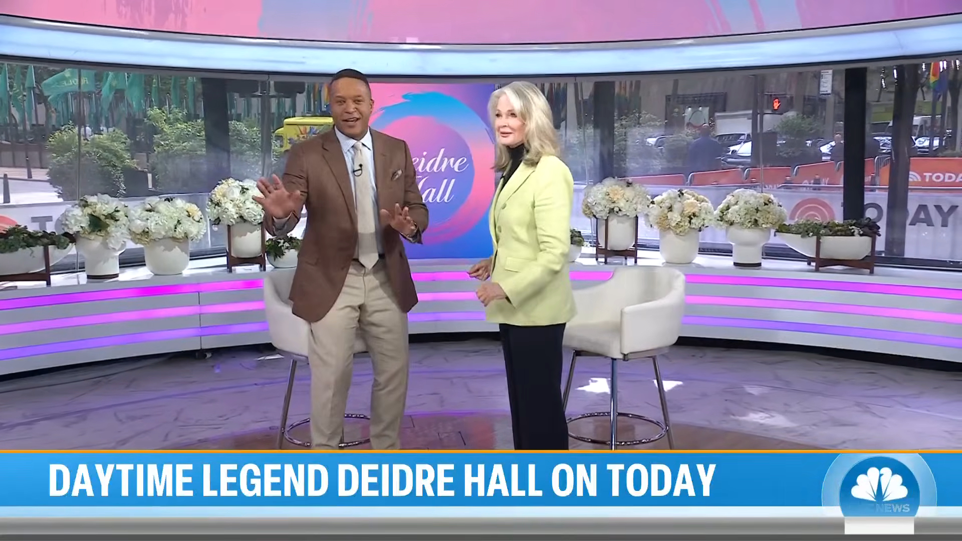 Craig Melvin and Deidre Hall standing on the TODAY show set.