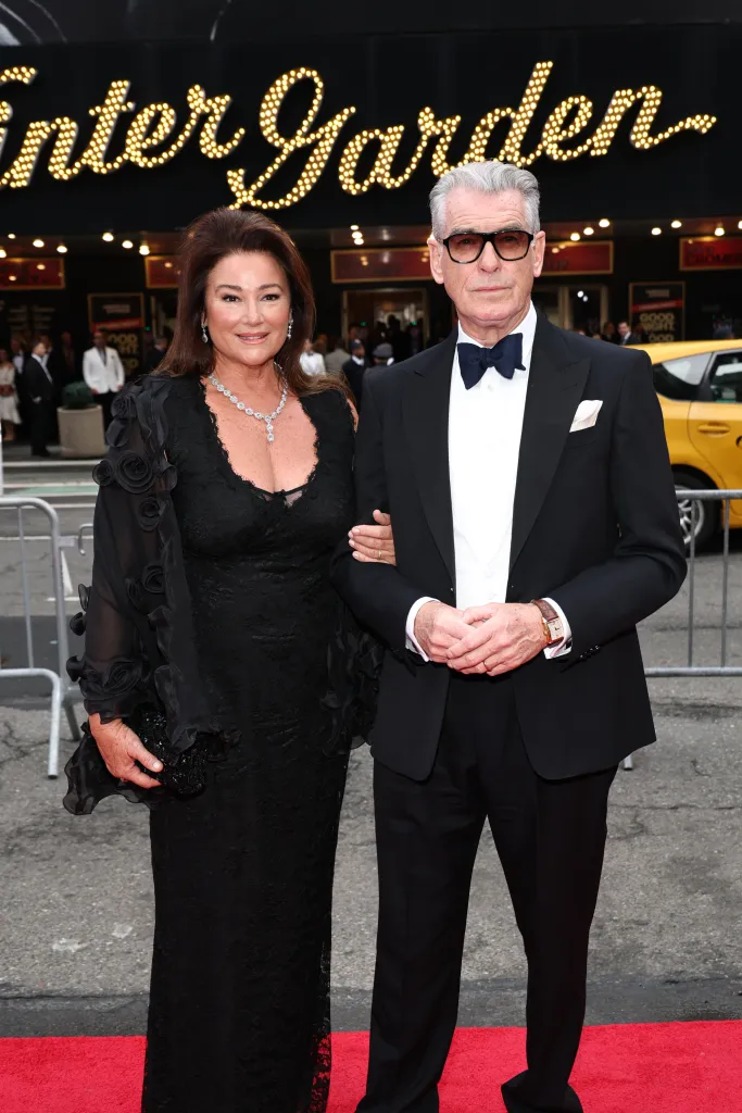 Pierce Brosnan and his wife Keely Shaye Smith posing on a red carpet.