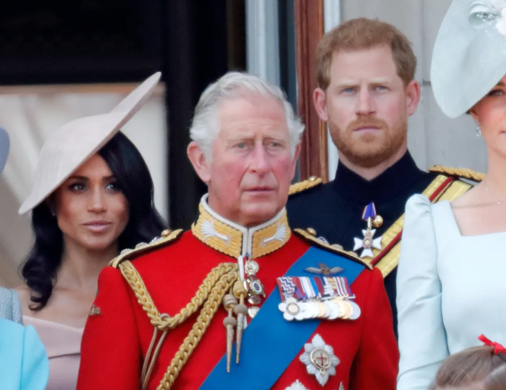 Meghan, Duchess of Sussex, Prince Charles, Prince of Wales, and Prince Harry, Duke of Sussex, stand on the balcony of Buckingham Palace during Trooping The Colour 2018.