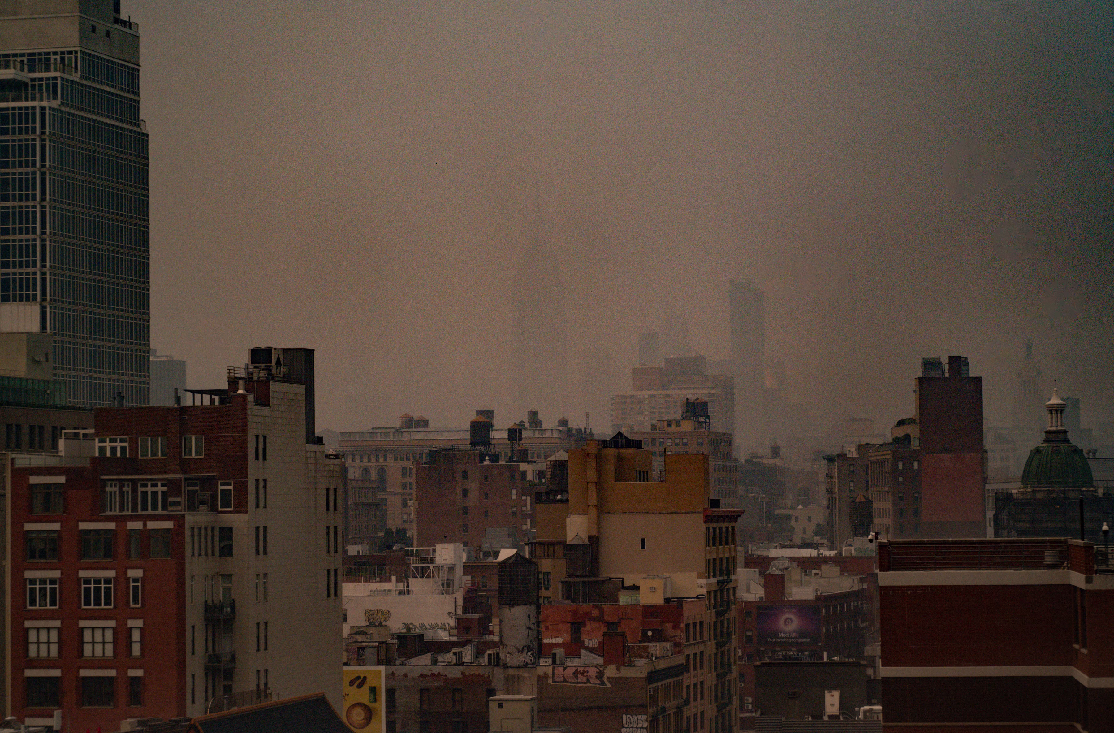 Wildfire smoke obscures the skyline in Manhattan.