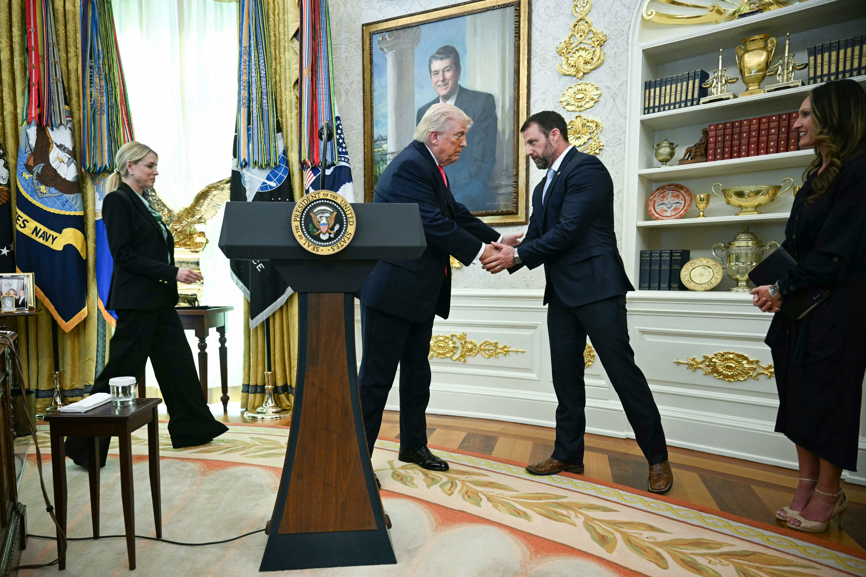 two men shake hands