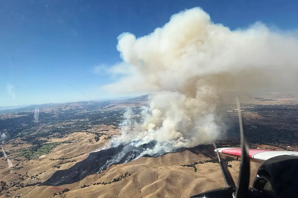 Fast-moving Bay Area wildfire erupts near homes, forcing evacuations
