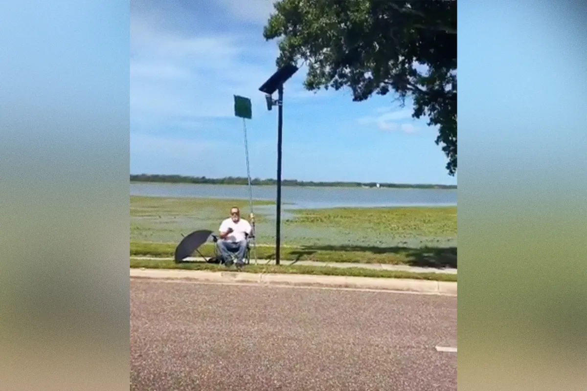 Wild Footage Shows Man Blocking Flock Camera With Comically Gigantic Protest Sign