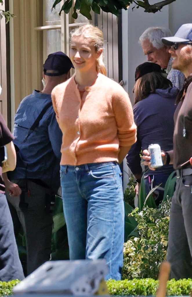 Apple Martin smiling on the set of "Paris Paramount."