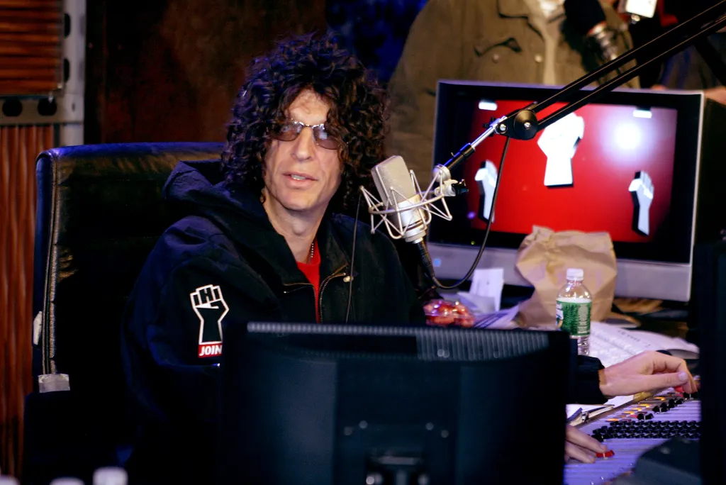Howard Stern sits in a radio studio on his debut broadcast for Sirius Satellite Radio.