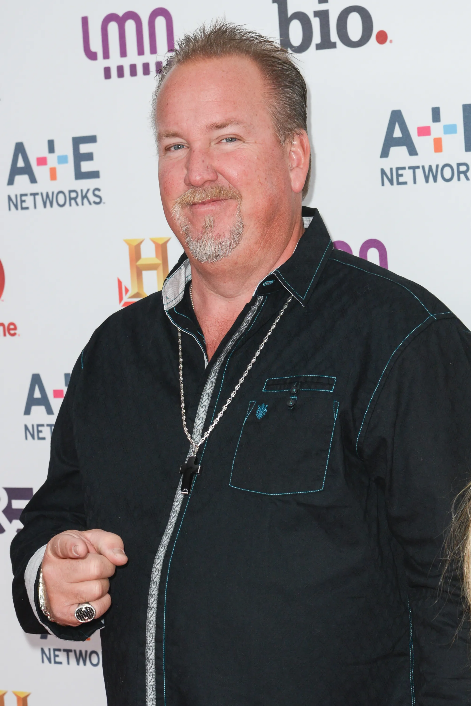 Darrell Sheets at A+E Networks Upfront in 2013, wearing a black shirt and a cross necklace.