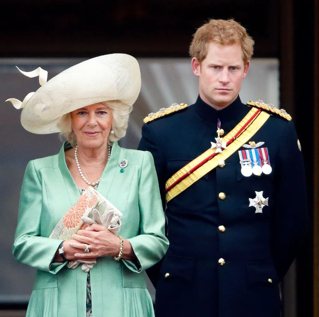 Camilla, Duchess of Cornwall, and Prince Harry stand on the balcony of Buckingham Palace during Trooping the Colour.