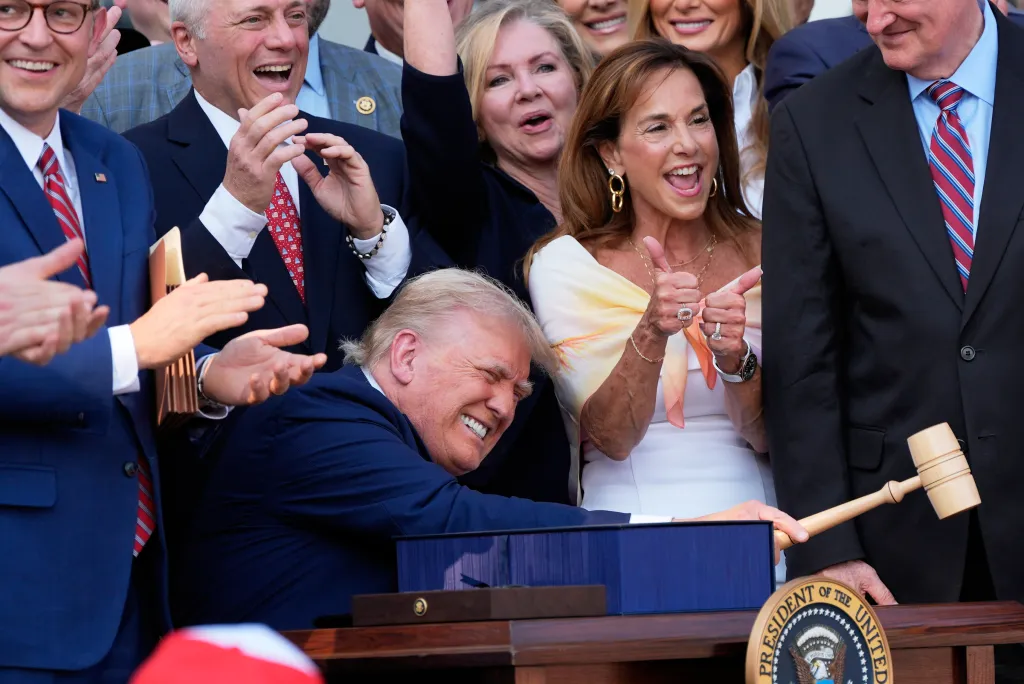 President Donald Trump bangs a gavel after signing the "One, Big Beautiful Bill" Act into law.