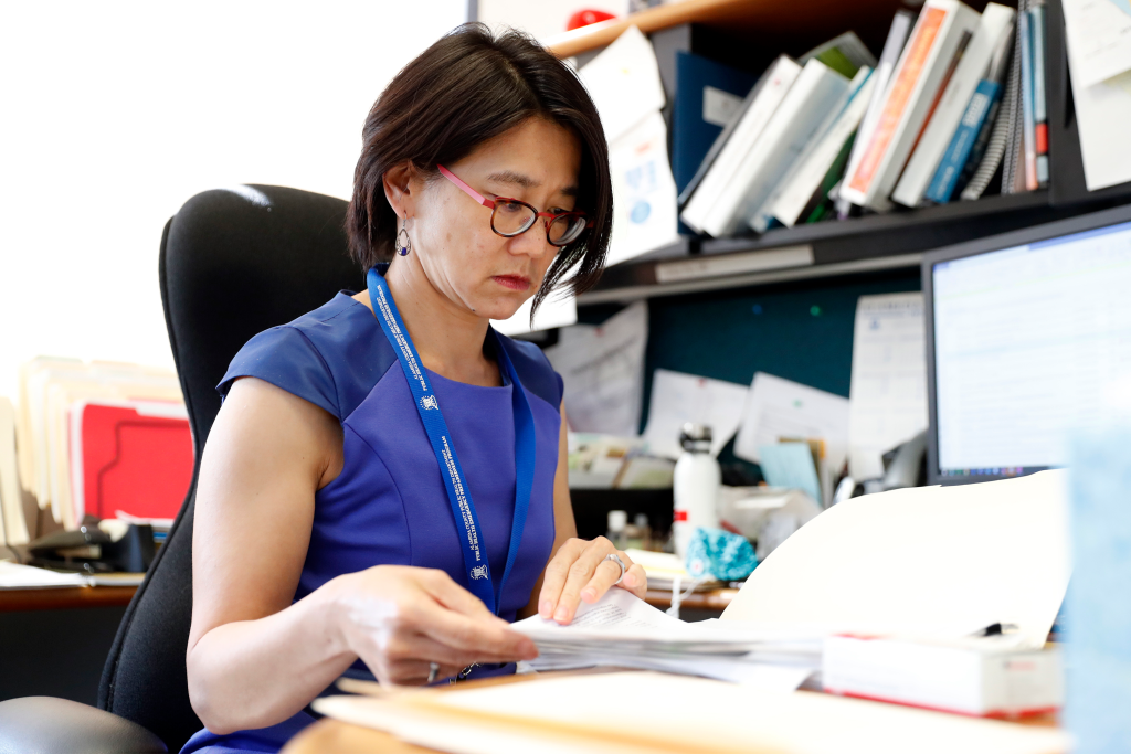 Dr. Erica Pan, Alameda County Public Health Officer, works at her desk in her office.