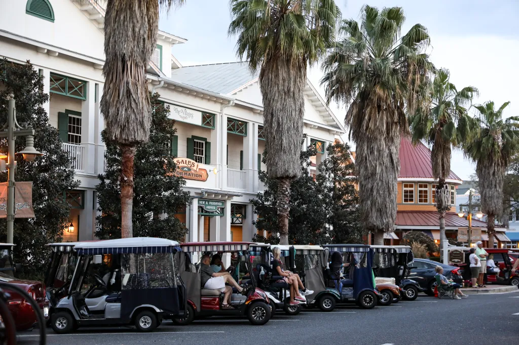 Golf carts lined up in Lake Sumter Landing Market Square in The Villages, Florida.