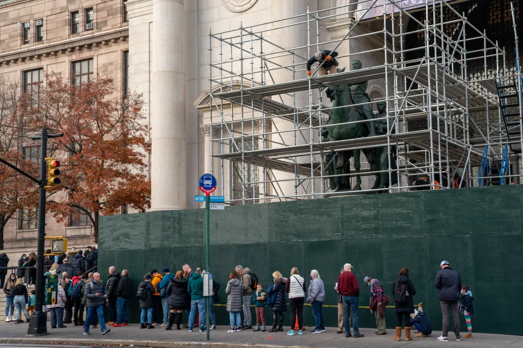 Construction workers erecting scaffolding around the President Theodore Roosevelt statue at the American Museum of Natural History as it is prepared for removal.