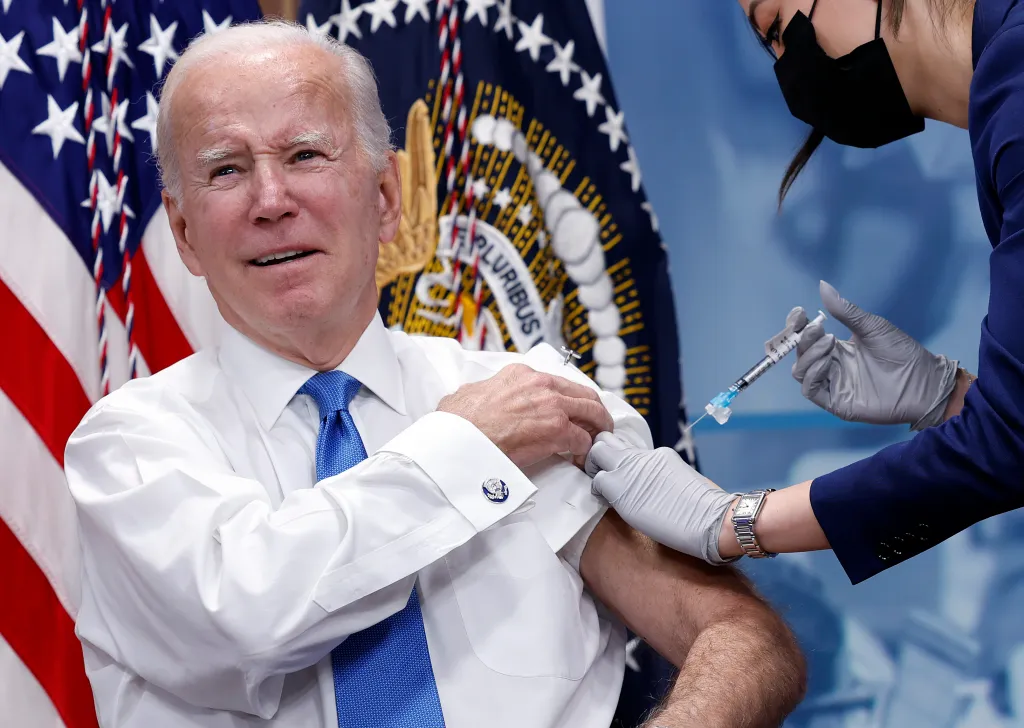 President Joe Biden receiving an updated COVID-19 booster shot.