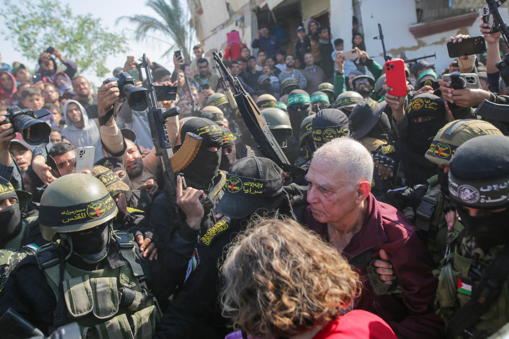 Gadi Moses, 80, escorted by Hamas and Islamic Jihad fighters in Khan Younis, southern Gaza Strip.