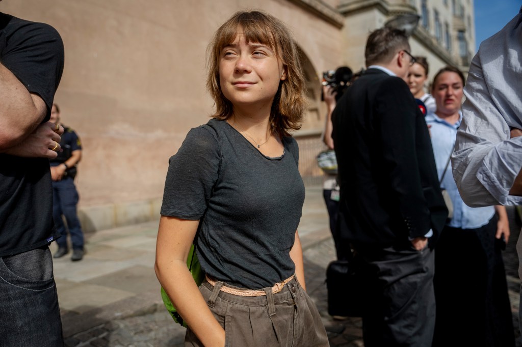 Greta Thunberg stands outside Copenhagen City Court.