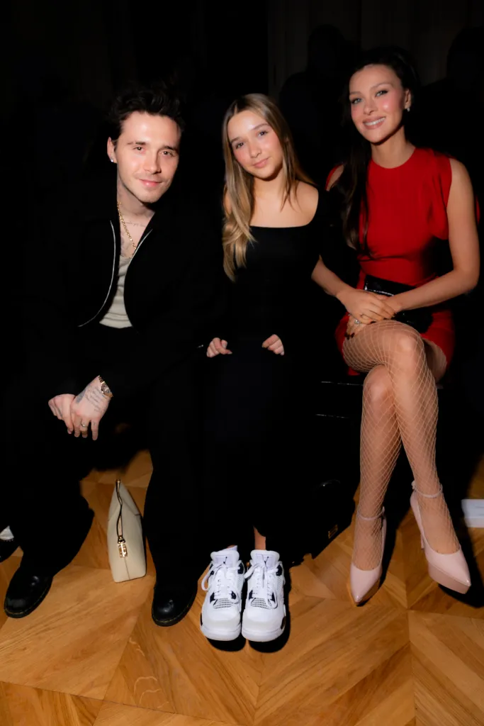Brooklyn Beckham, Harper Beckham, and Nicola Peltz Beckham at Victoria Beckham RTW Fall 2024.