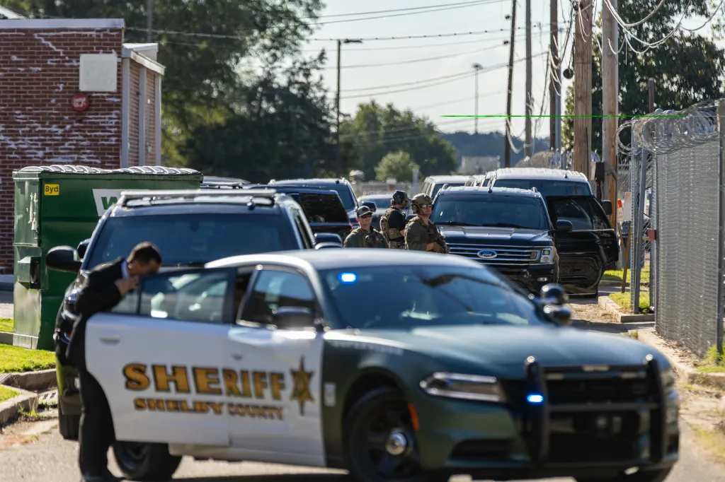 Law enforcement officials and vehicles gathered at the Shelby County Office of Preparedness in Memphis, Tennessee.