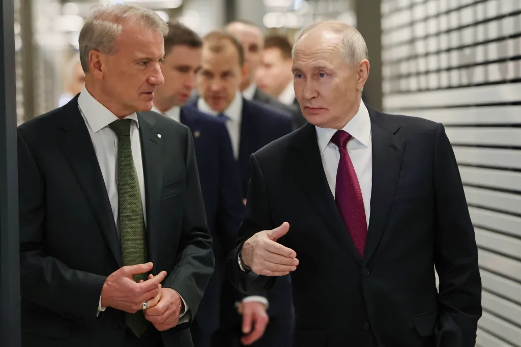 Russian President Vladimir Putin speaking with Sberbank CEO German Gref.