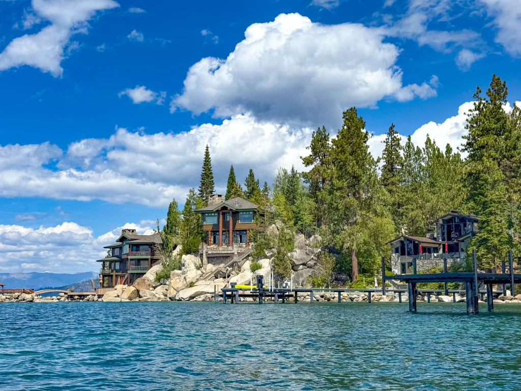 Pier in front of shoreline homes on Lake Tahoe, at Zephyr Cove, Nevada, USA.