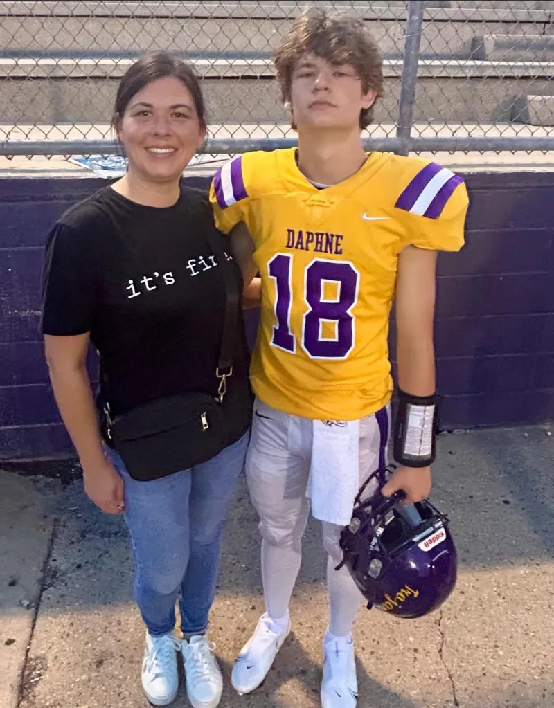 Samantha Baker and her son Brandon Baker, a football player, pose for a photo.