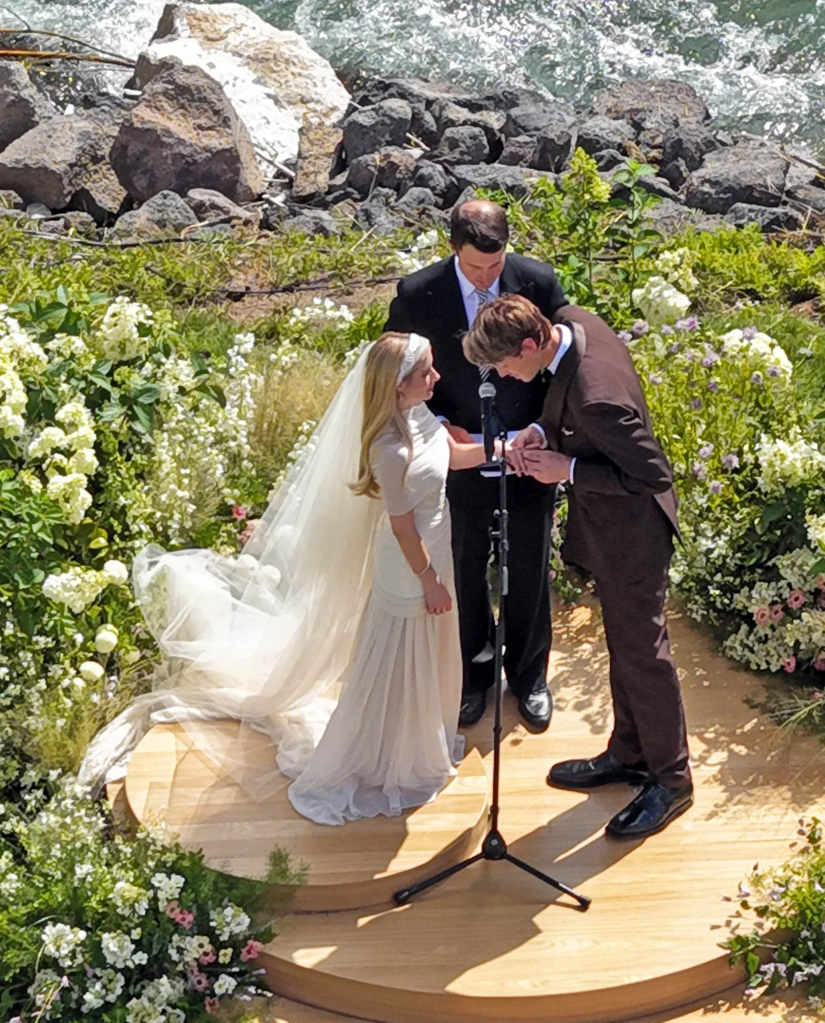 Emma Roberts and Cody John exchanging rings during their wedding ceremony.