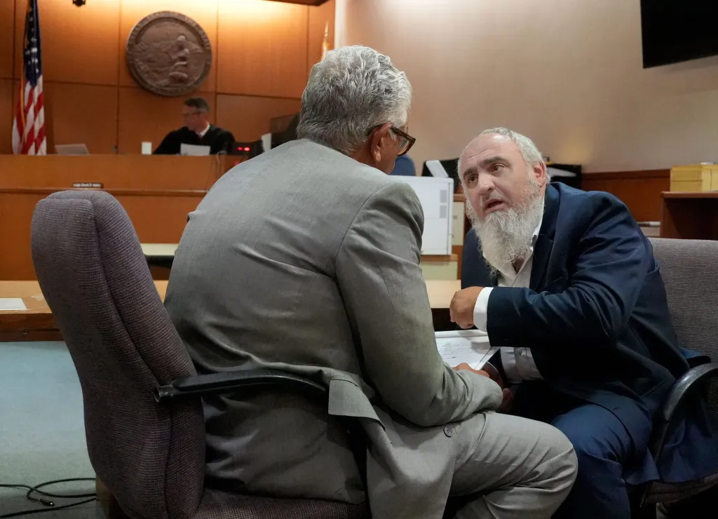 Attorney Ron Bamieh and his client Loay Alnaji appear in court.