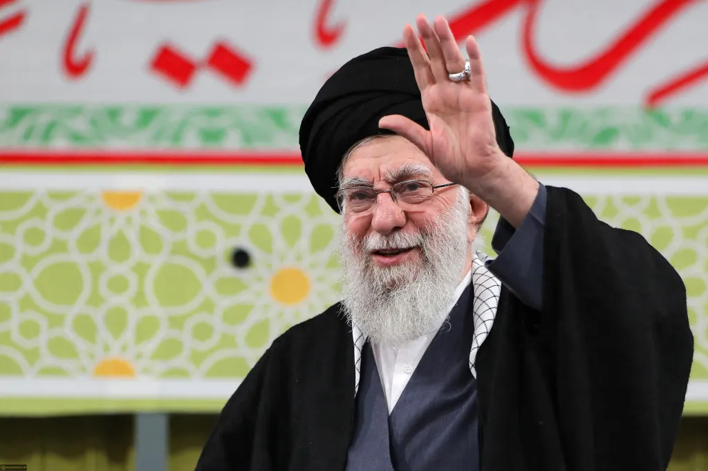 Iran's Supreme Leader Ayatollah Ali Khamenei waves to the crowd.