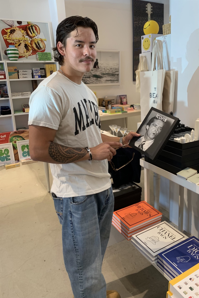 Collin Gosselin holding a framed picture of Jack Nicholson at Kitson.