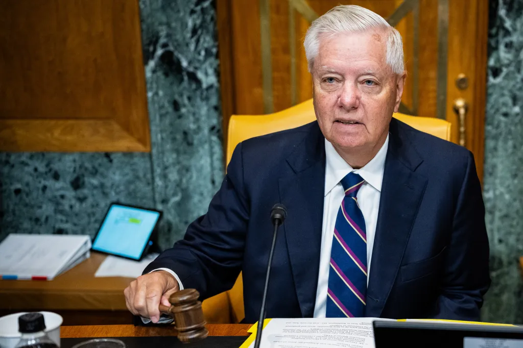 Senator Lindsey Graham holding a gavel during a confirmation hearing.