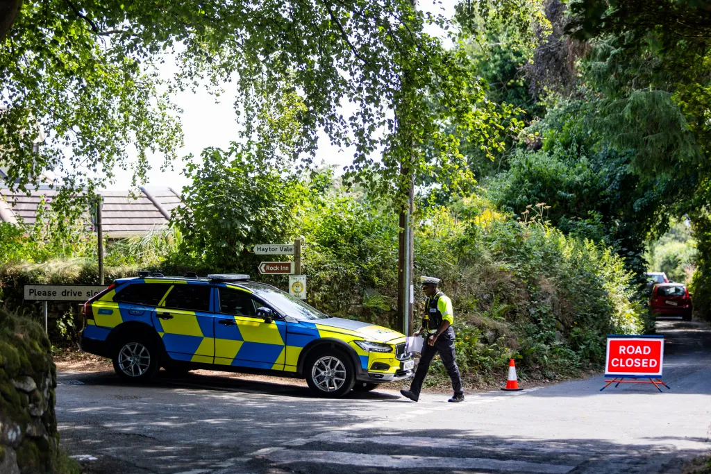 Police block off the road leading to Ann Widdecombe's house during a murder investigation.