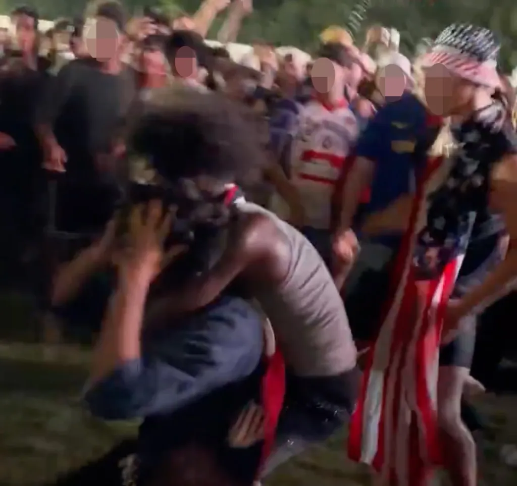 A large group of people fighting at the FIFA World Cup 2026 Fan Zone.