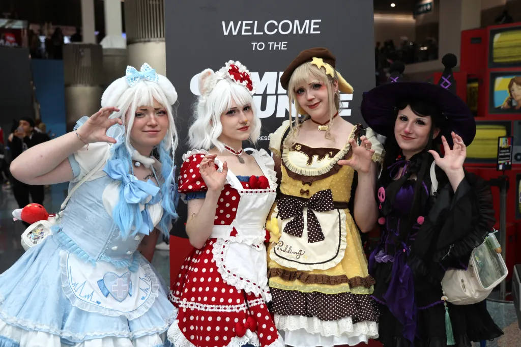 Four anime fans pose for photos at Anime Expo 2026.