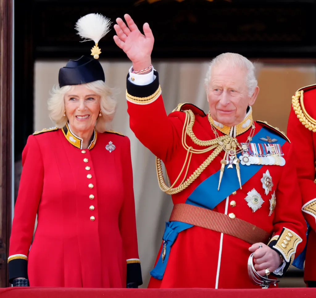 Queen Camilla and King Charles III watch an RAF flypast from the balcony of Buckingham Palace.