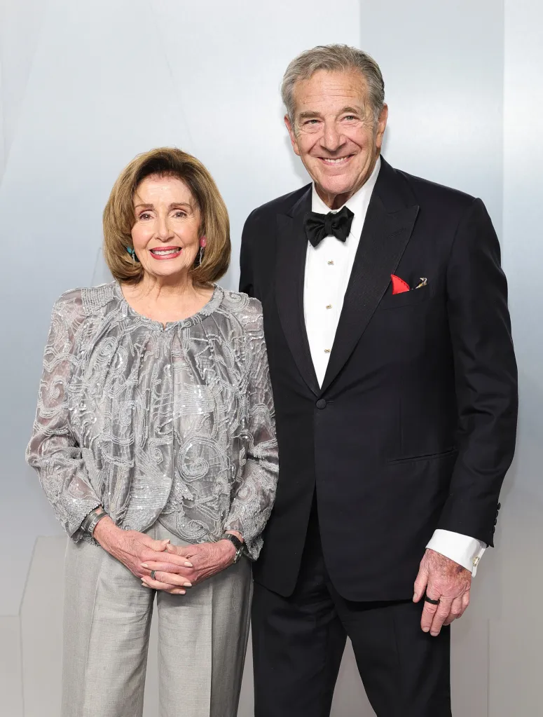 Nancy Pelosi and Paul Pelosi pose for a photo.